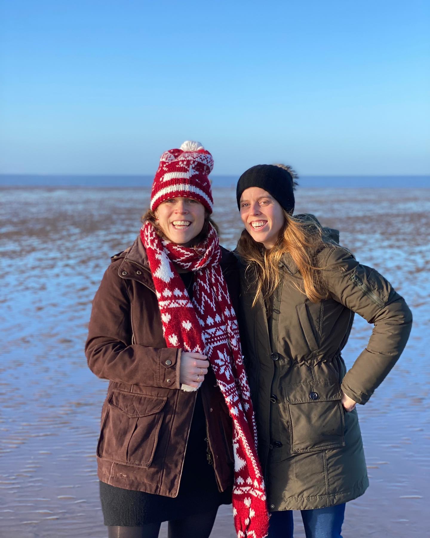 The sisters smiling. 