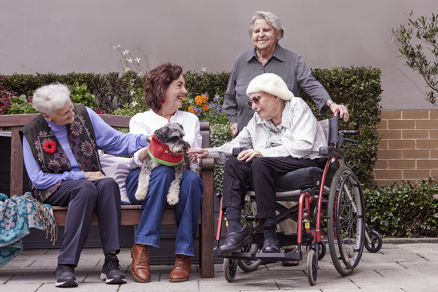 An elderly woman and volunteers.