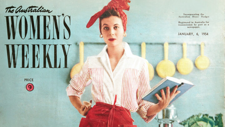 Magazine cover. A woman holds a cookbook in a kitchen.