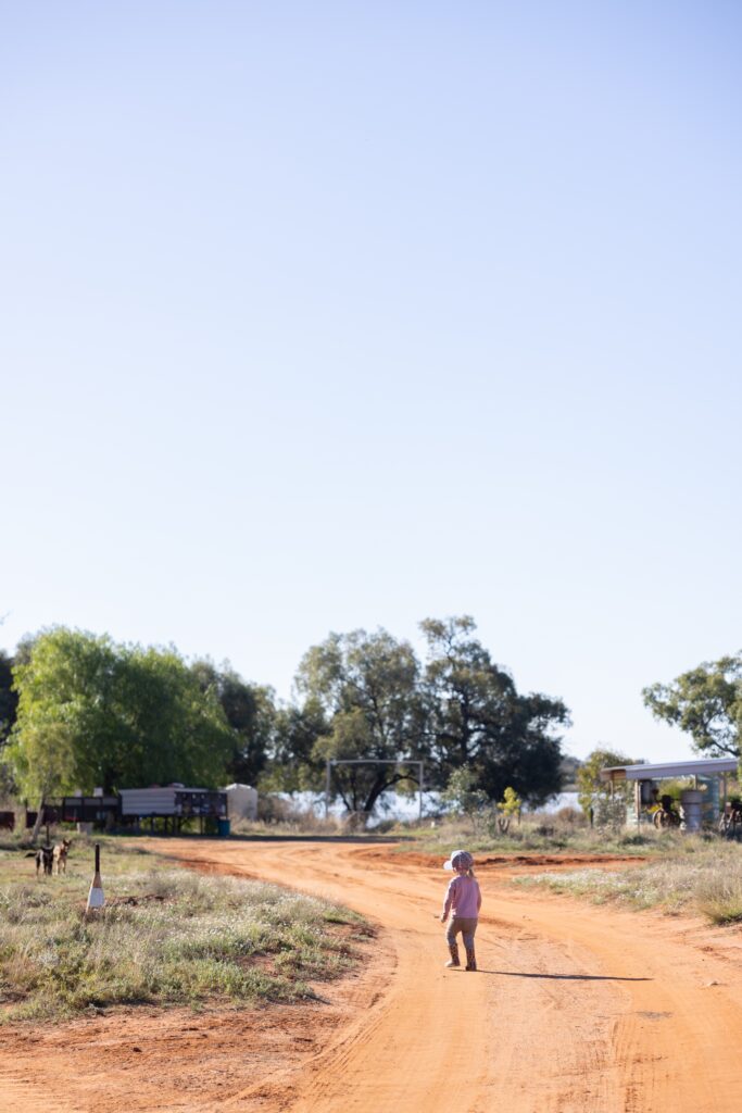 A young child on a dirt road