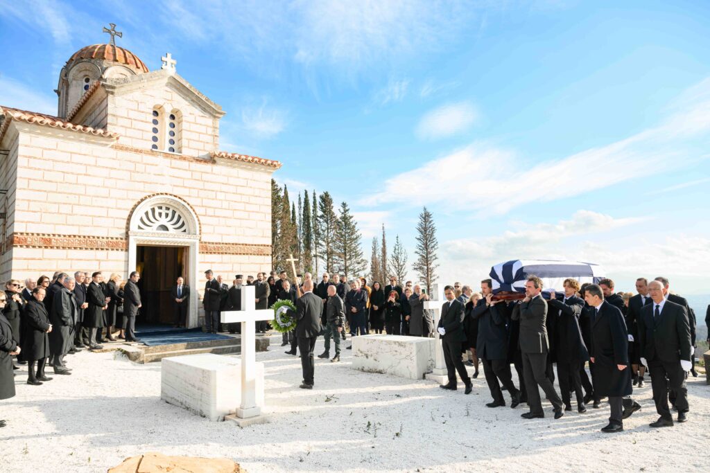 A funeral procession outside a church. 