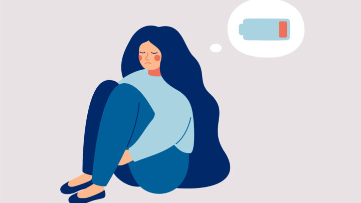 An illustration of a woman hugging her knees with a flat battery in her thoughts. Symbolic of symptoms of burnout.