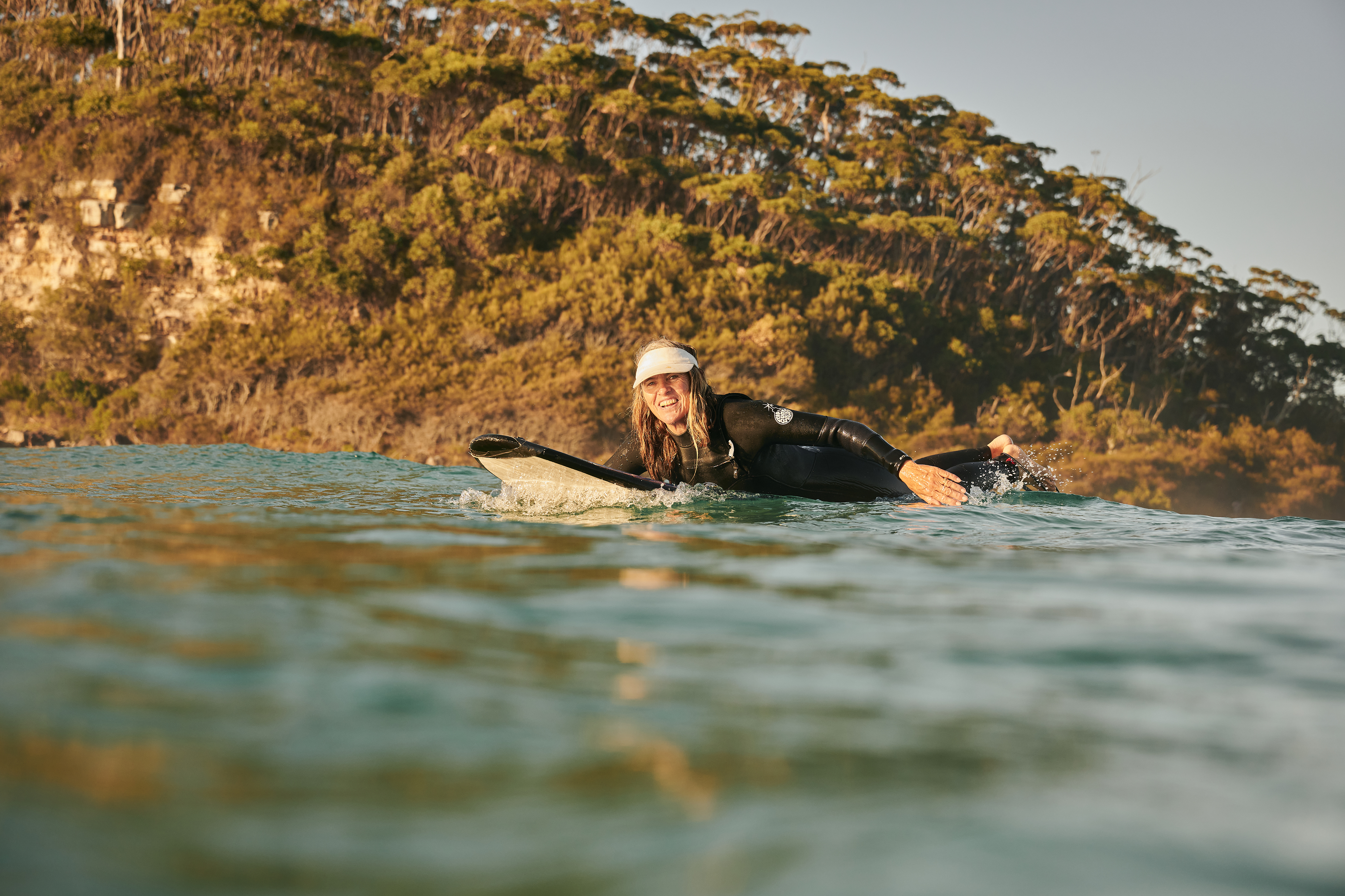 Australian female surfer Pam Burridge on her surfboard. 