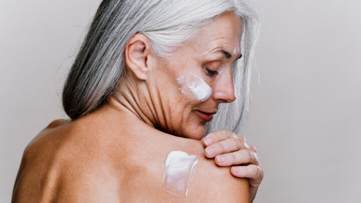 Image of a beautiful senior woman posing on a beauty photo session. Middle aged woman on a colored background. Concept about body positivity, self esteem and body acceptance