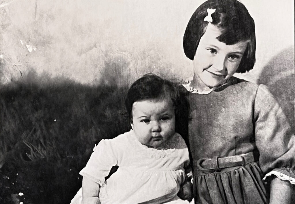 A young Julie Forster and sister Elizabeth, who were religiously covered in Johnson & Johnson baby powder after a bath as a child. 