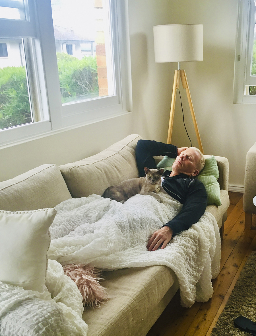 Hamish McLaren asleep with Tracy's cat. 