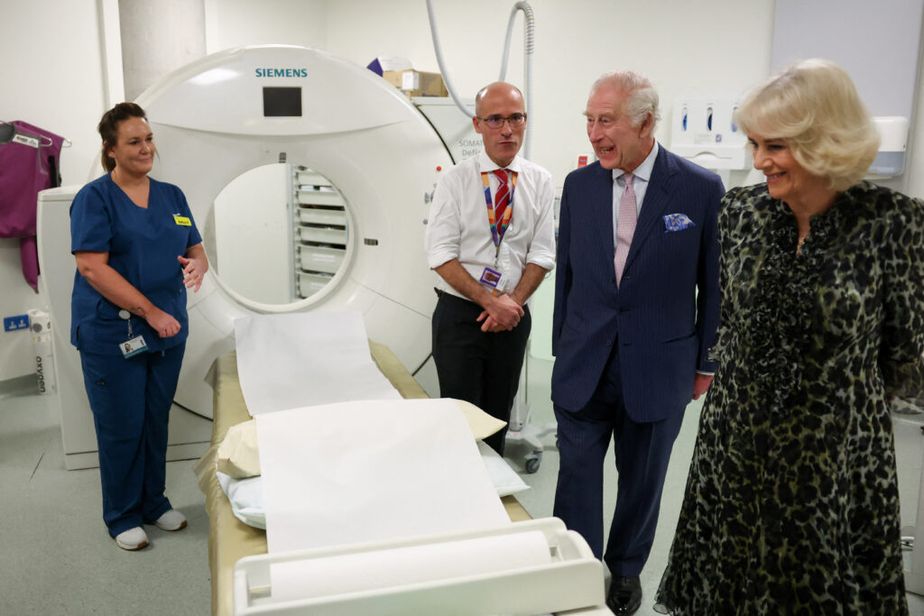 King Charles III and Queen Camilla look at the CT scanner next to Cancer Research UK's Chief Clinician, Charlie Swanton during a visit at the University College Hospital Macmillan Cancer Centre on April 30, 2024 in London, England. (Photo by Suzanne Plunkett - WPA Pool/Getty Images)