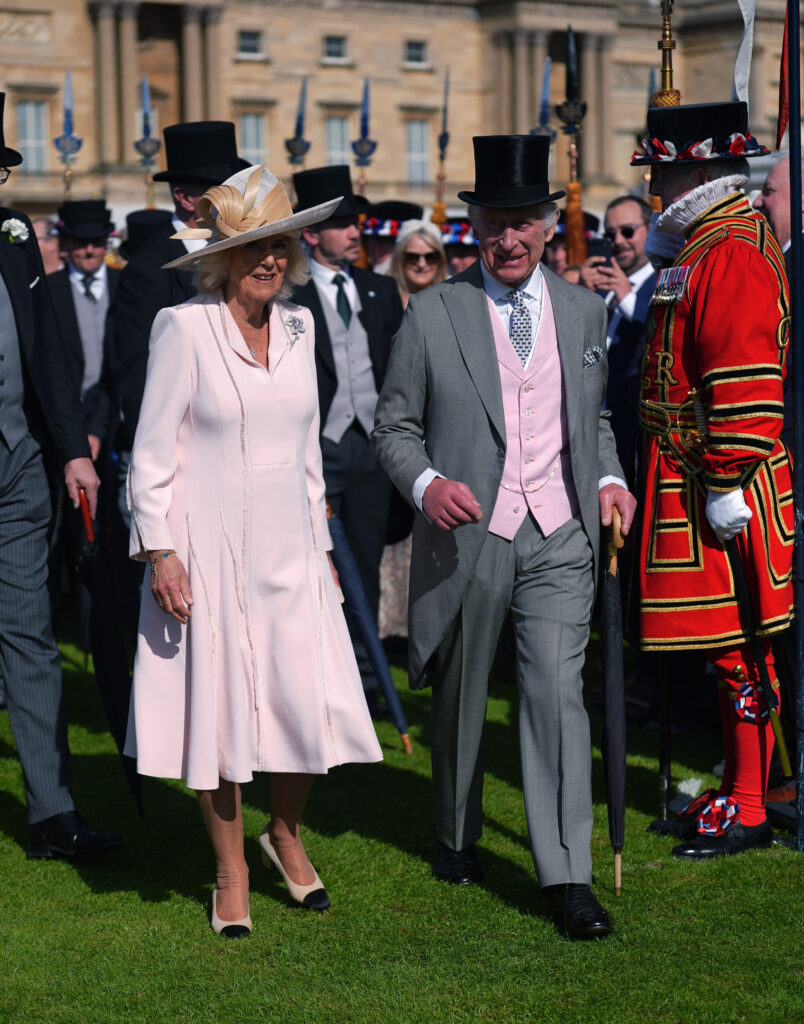 LONDON, ENGLAND - MAY 15: Queen Camilla and King Charles III during The Sovereign's Creative Industries Garden Party at Buckingham Palace on May 15, 2024 in London, England. Representatives across art, culture, heritage, TV, fashion and film attend the garden party hosted by the DCMS. (Photo by Yui Mok - WPA Pool/Getty Images)