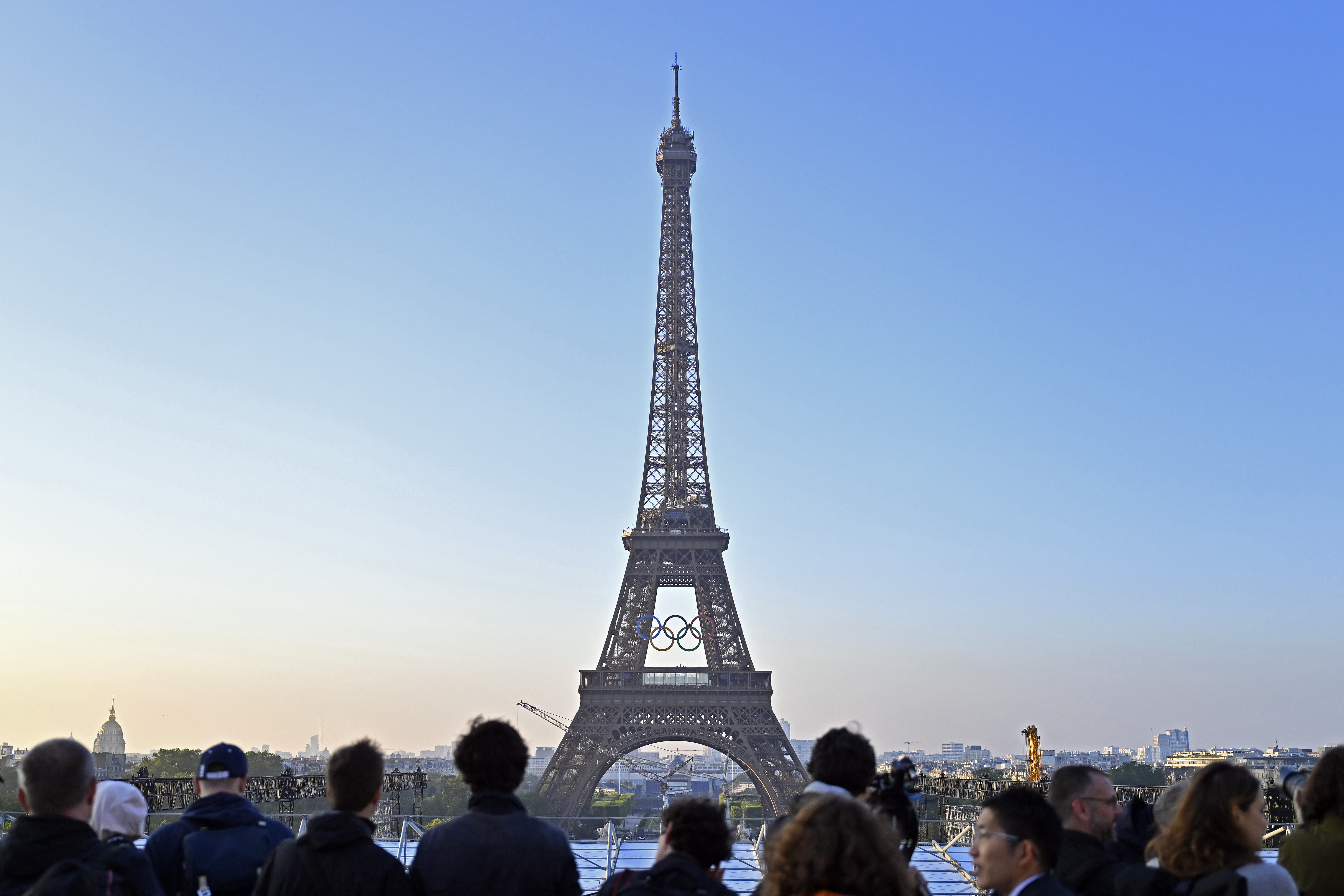 the eiffel tower with olympic rings displayed on it