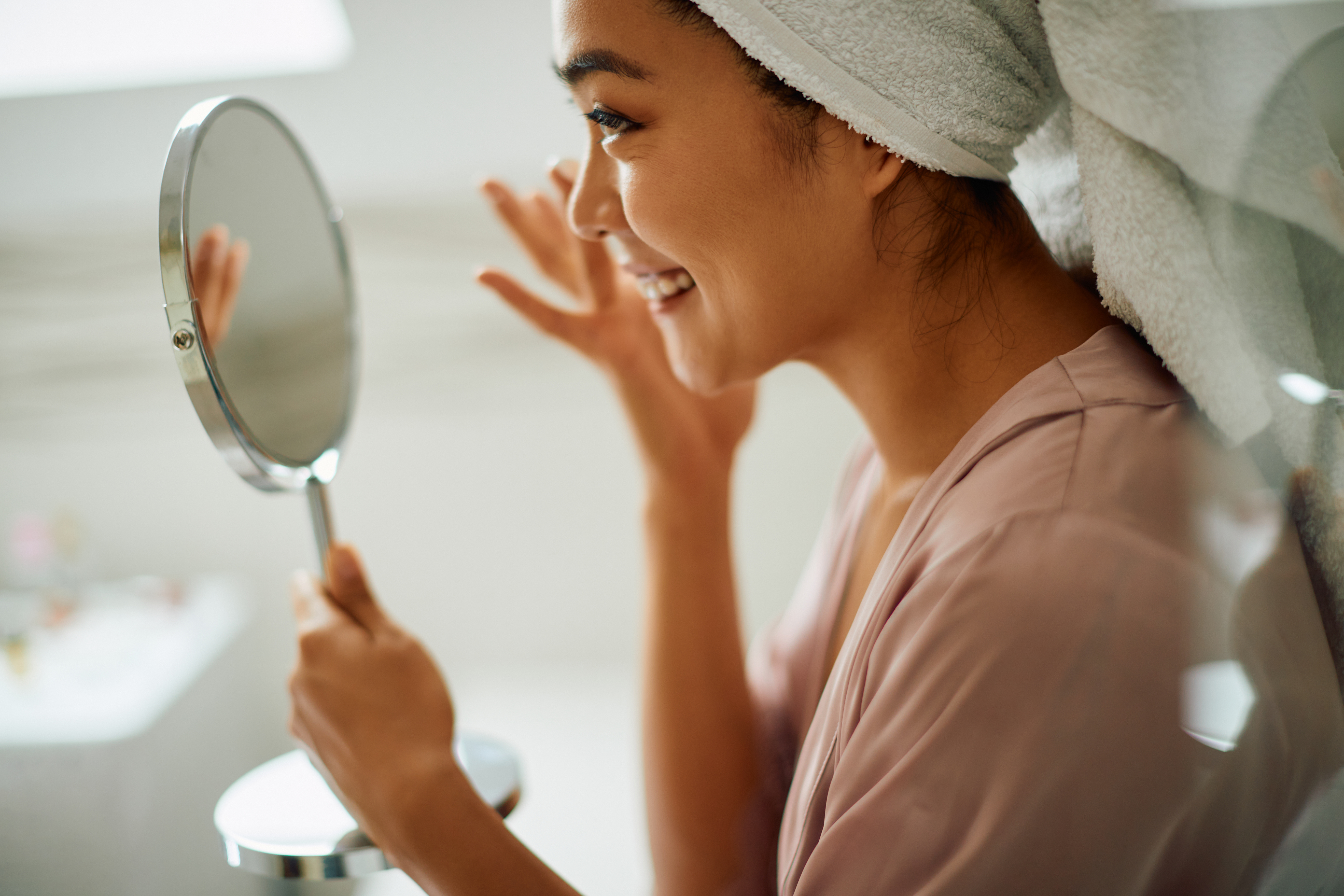 Woman using probiotics for skin. 